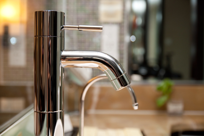 Leaking tap being repaired in Paddington